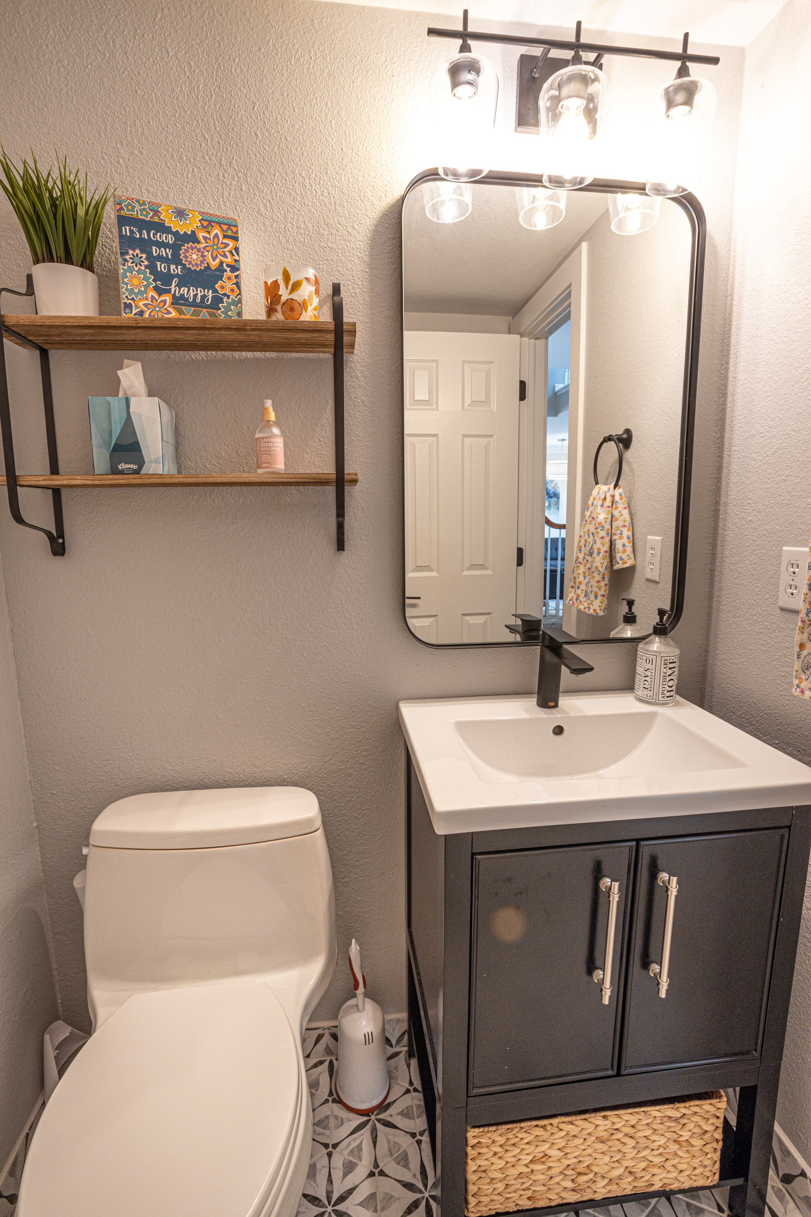 Small bathroom with patterned tile flooring
